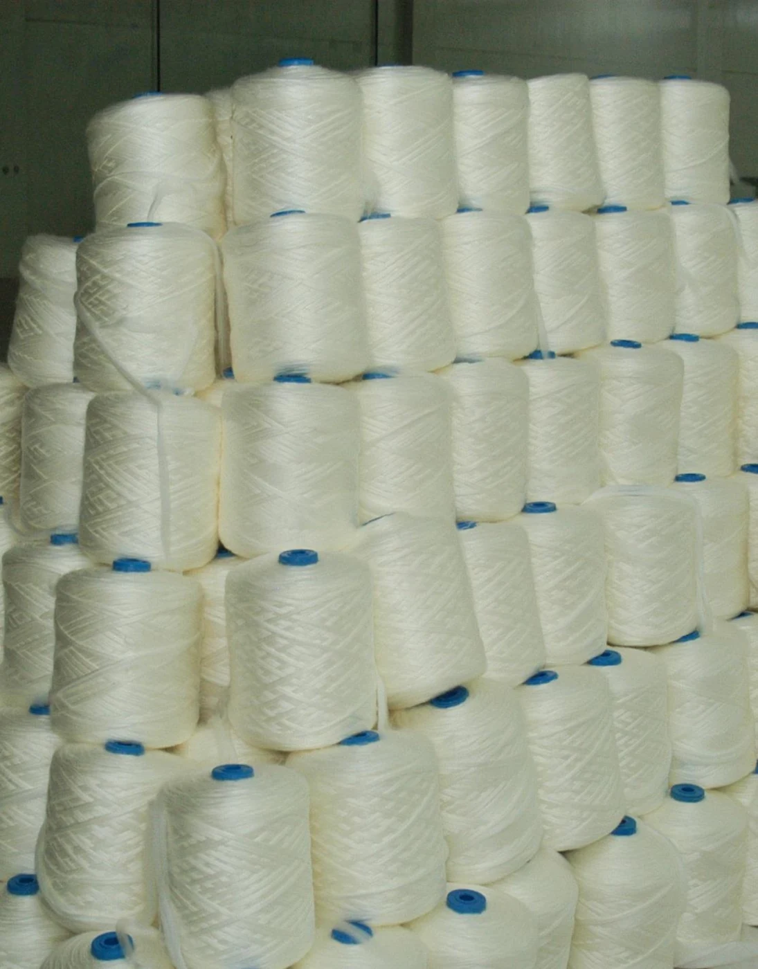 White yarn cones at the Kristina-Tex factory